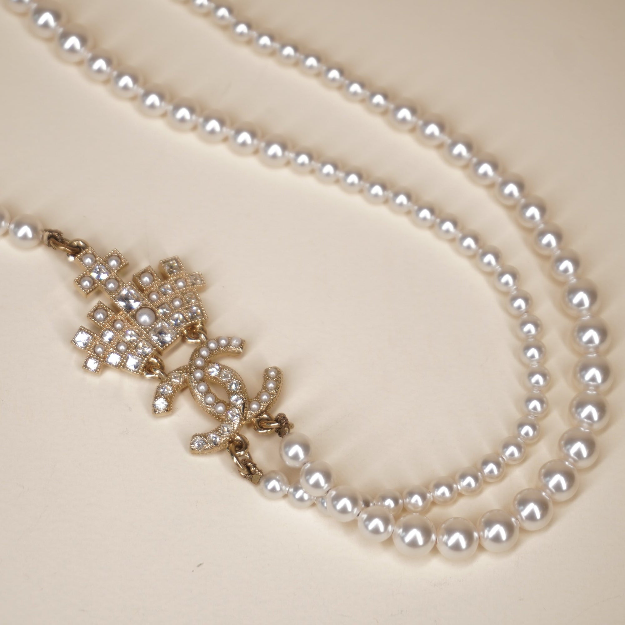 PRE-OWNED CC Pearl Necklace with Gold and Strass Crown