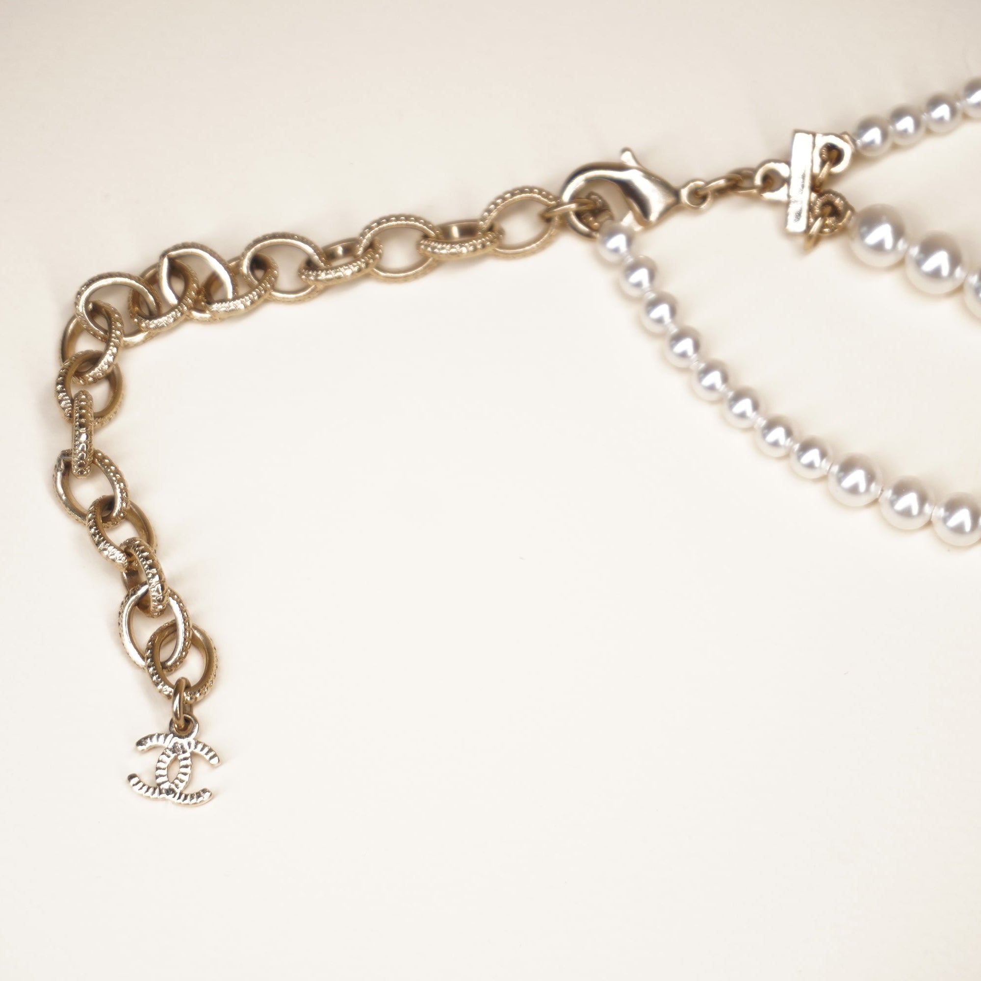 PRE-OWNED CC Pearl Necklace with Gold and Strass Crown