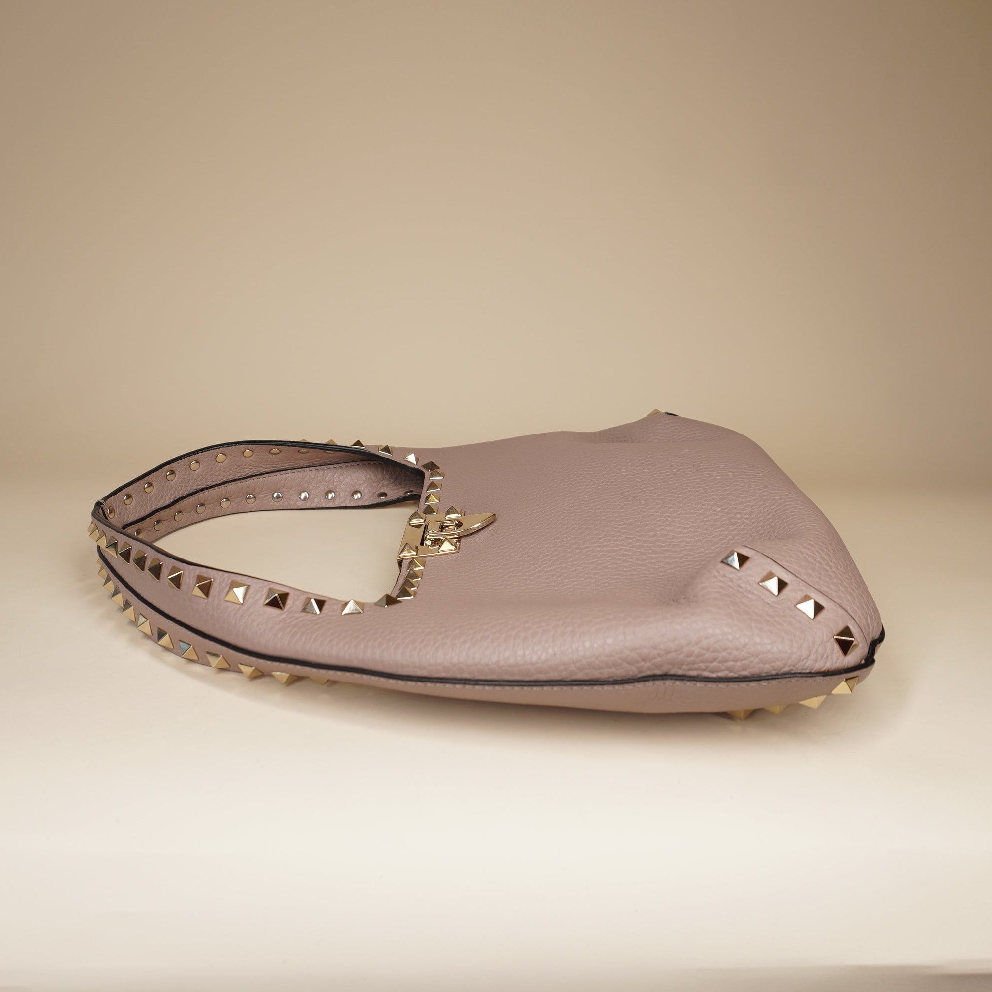 PRE-OWNED Pebbled Calfskin Small Rockstud Flip Lock Hobo Shoulder Bag