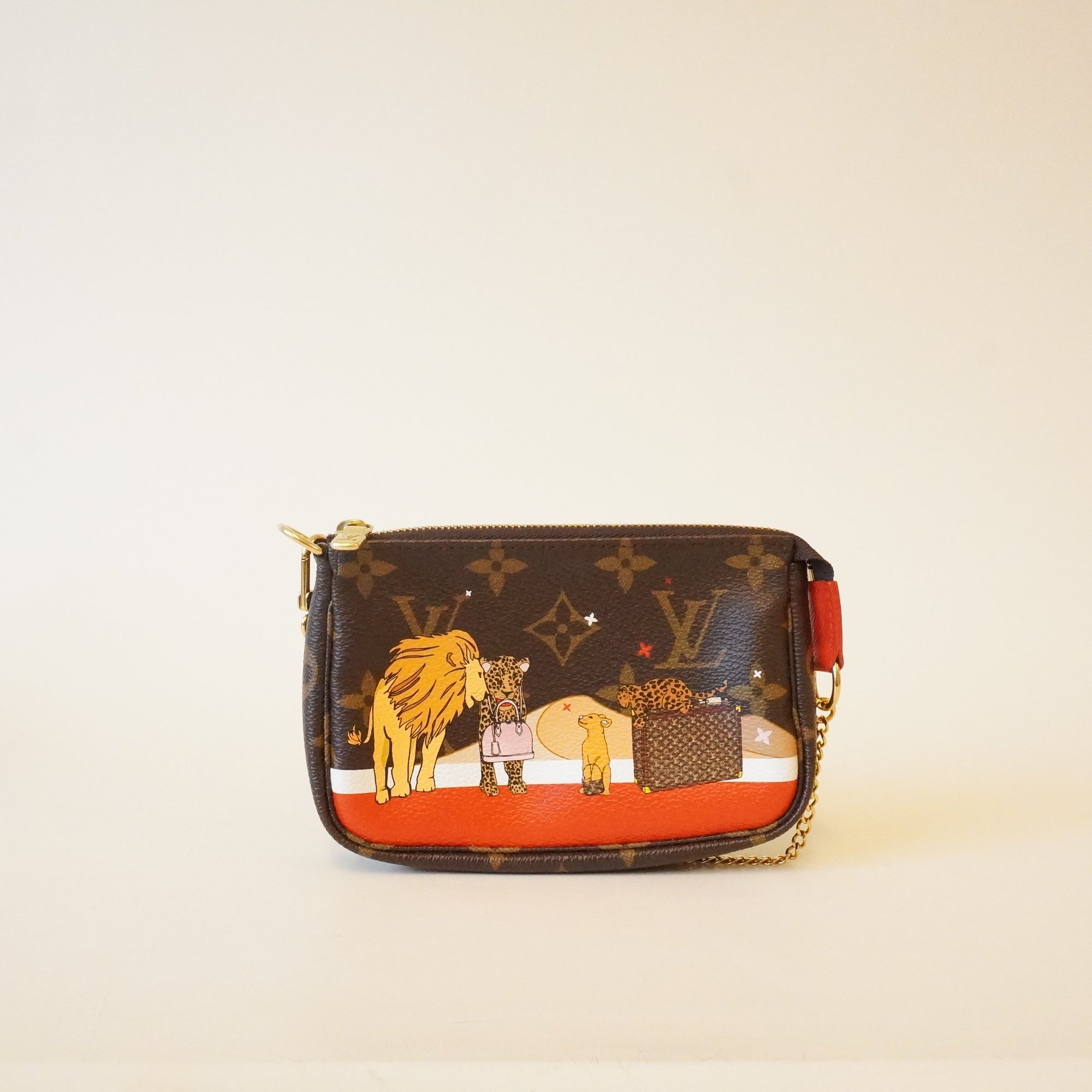 PRE-OWNED Mini Pochette Xmas lions monogram Limited Edition Minibag