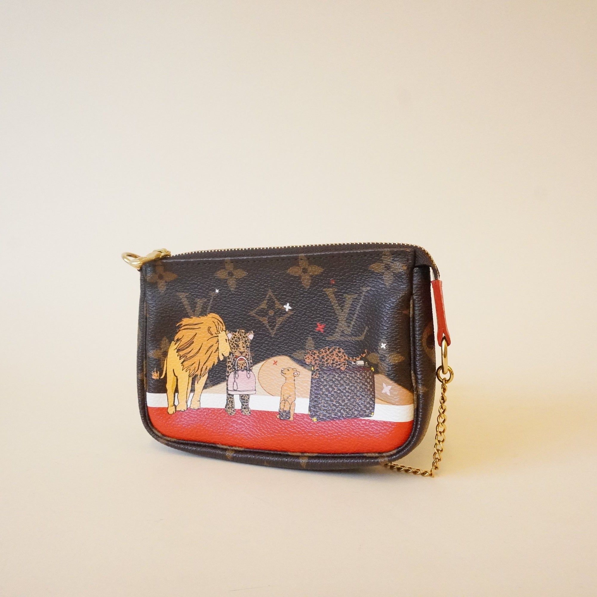 PRE-OWNED Mini Pochette Xmas lions monogram Limited Edition Minibag