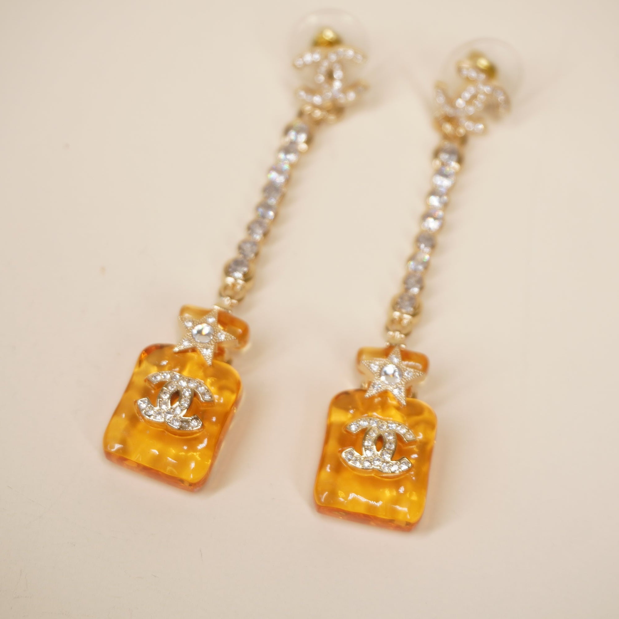 PRE-OWNED CC Earrings Perfume Bottle Motif Gold Orange