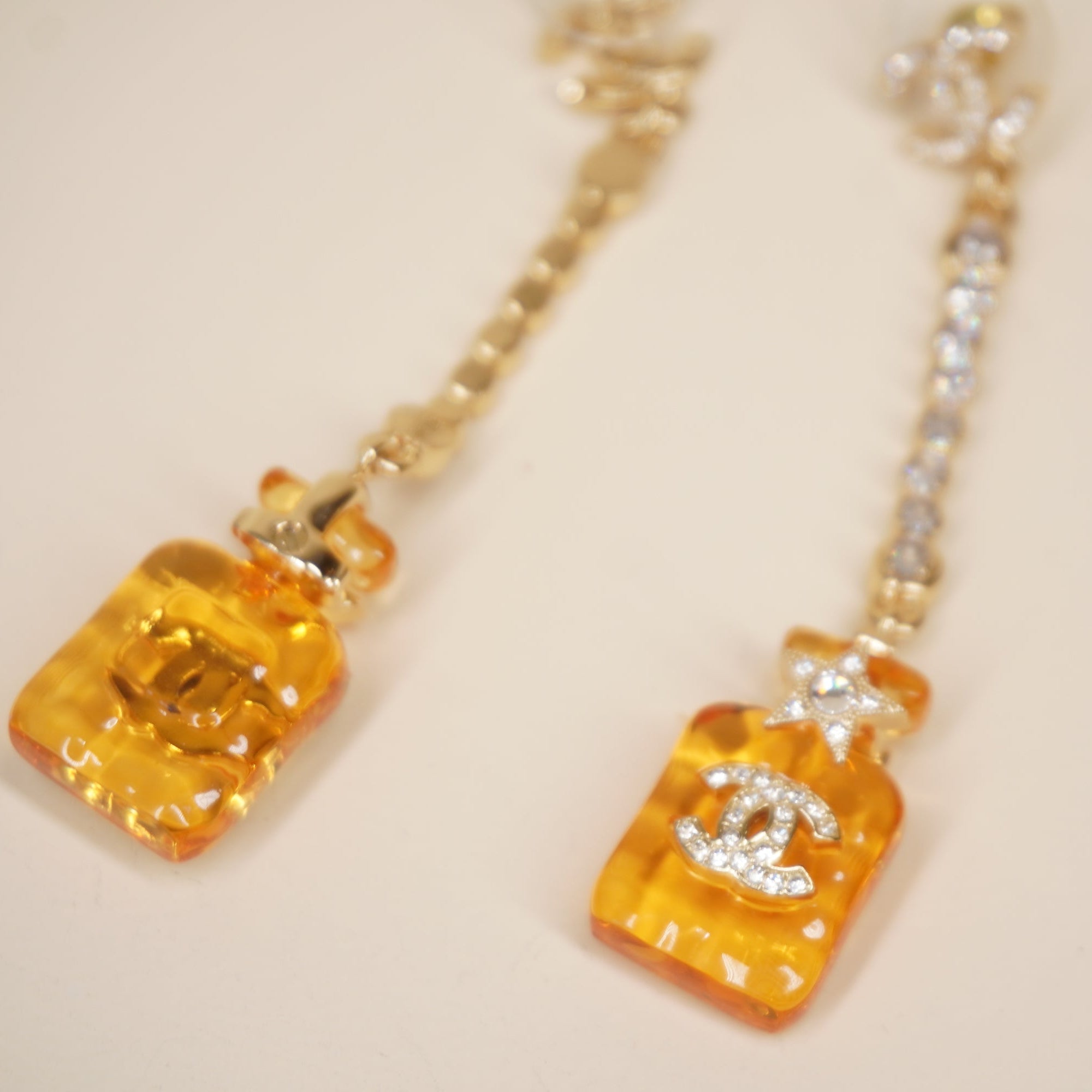 PRE-OWNED CC Earrings Perfume Bottle Motif Gold Orange