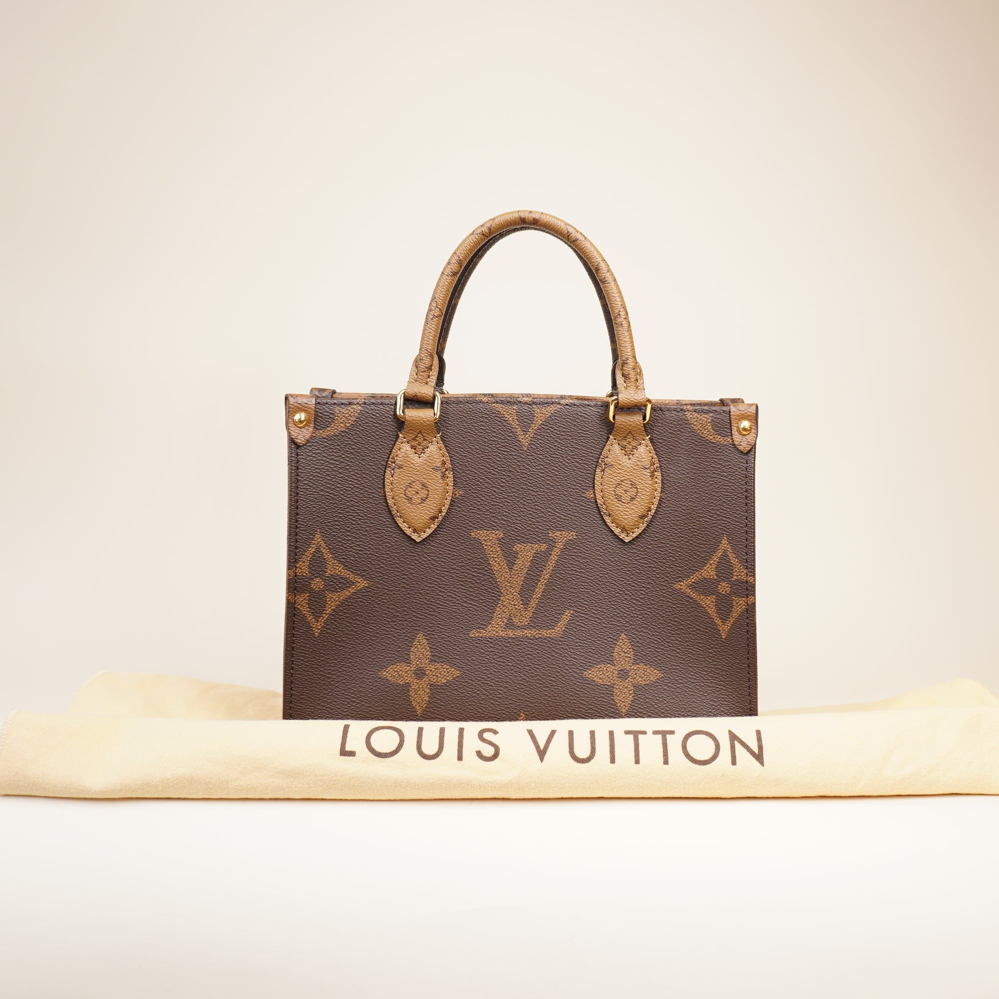 PRE-OWNED LV Monogram Reverse Giant OnTheGo PM Shoulder Bag