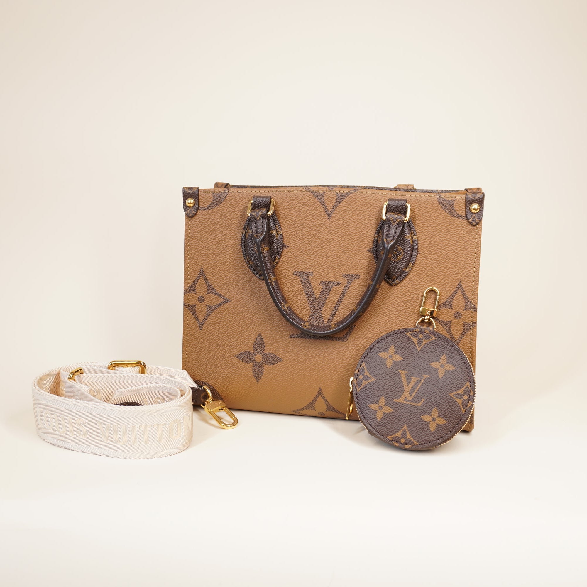 PRE-OWNED LV Monogram Reverse Giant OnTheGo PM Shoulder Bag