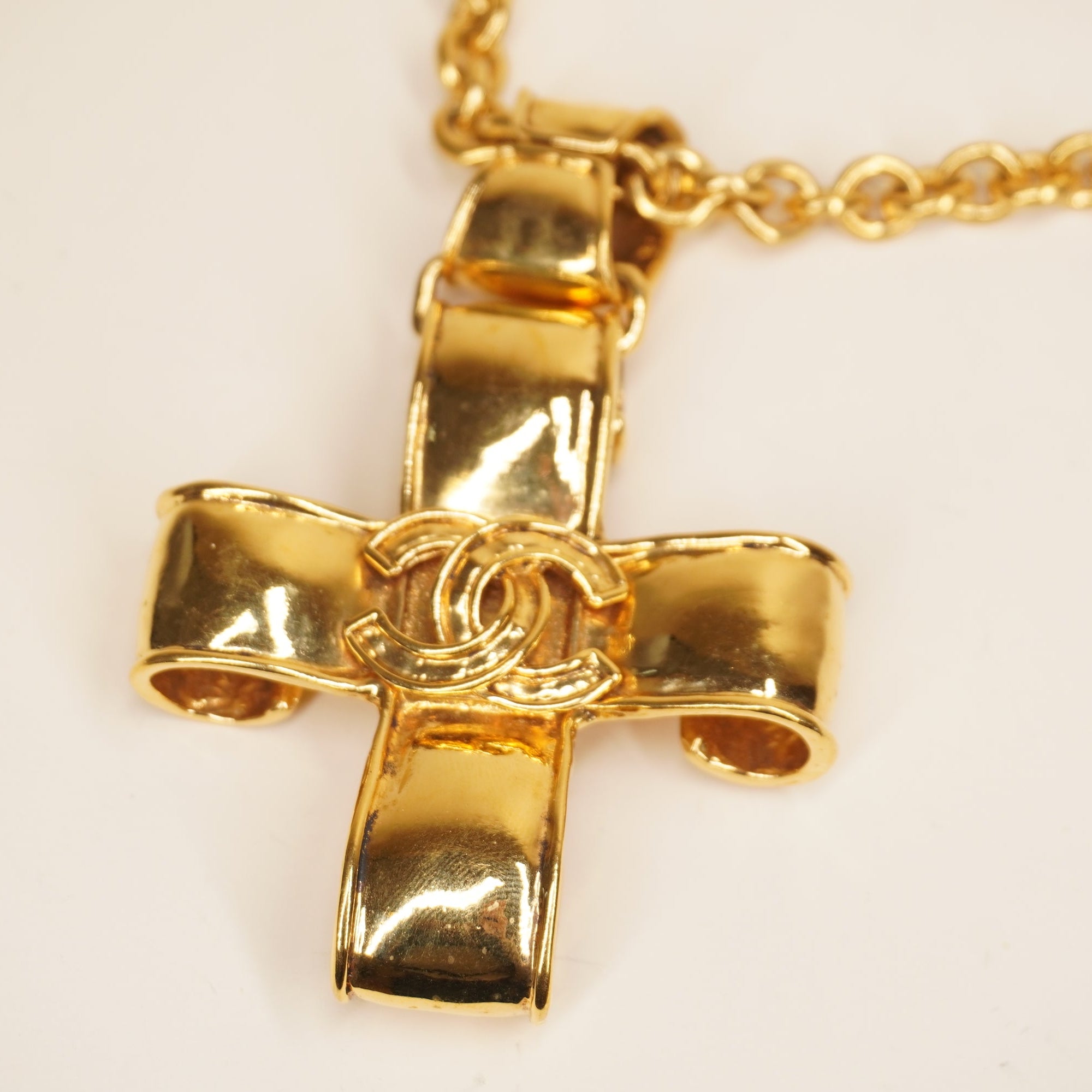 PRE-OWNED Vintage CC Ribbon Cross Pendant Necklace