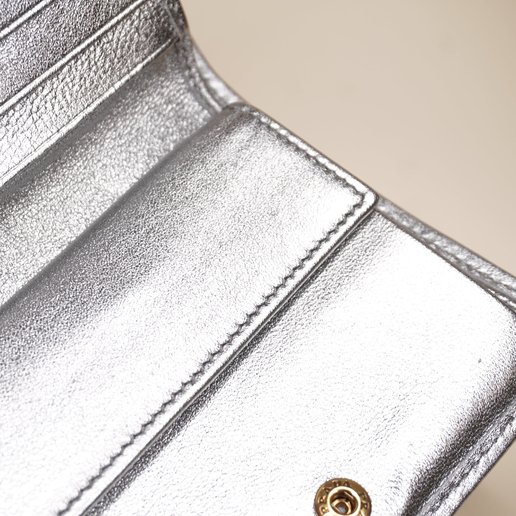 PRE-OWNED Silver Small Diagramme Embellished Quilted Wallet