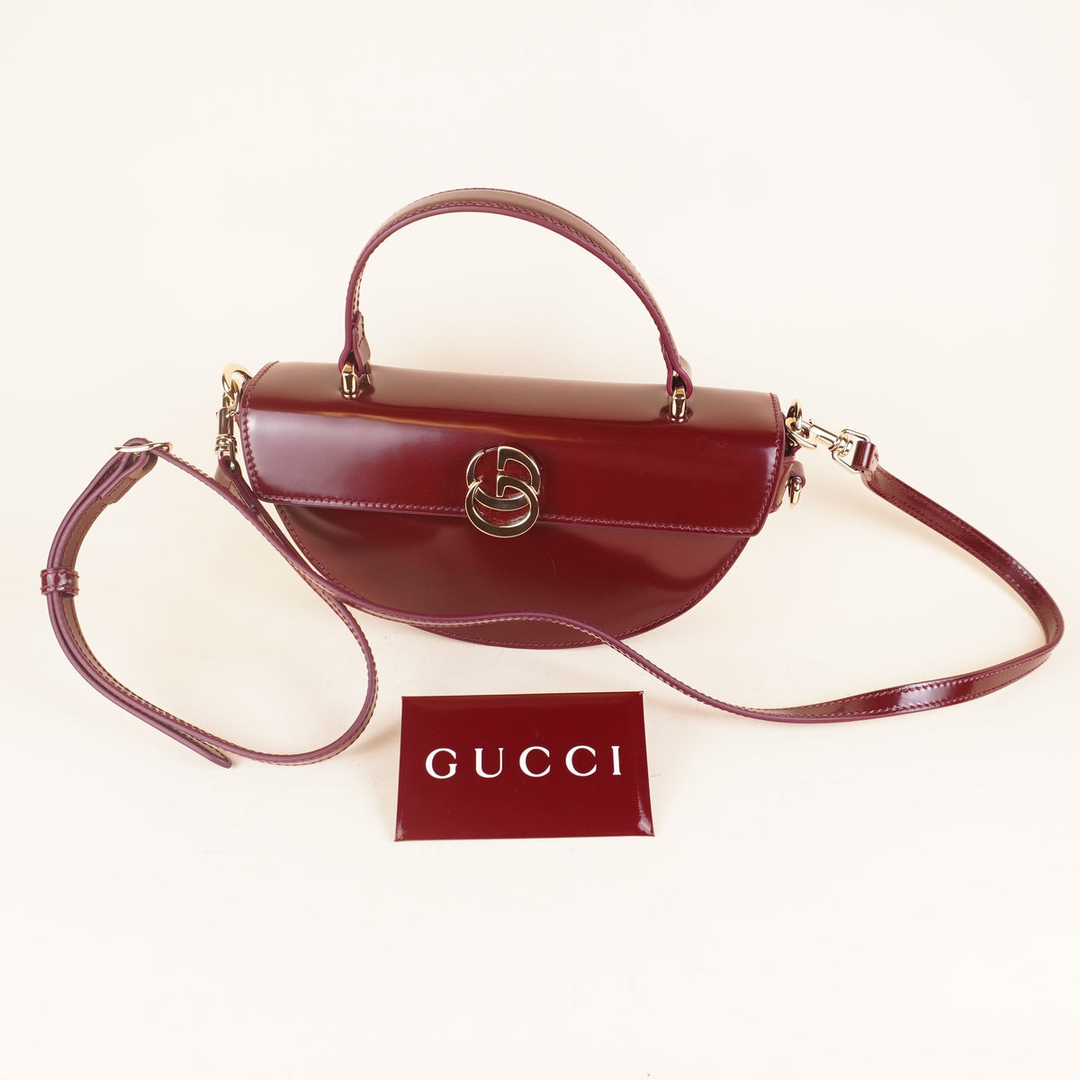 PRE-OWNED GG Interlocking G Half Moon Leather Crossbody Bag 