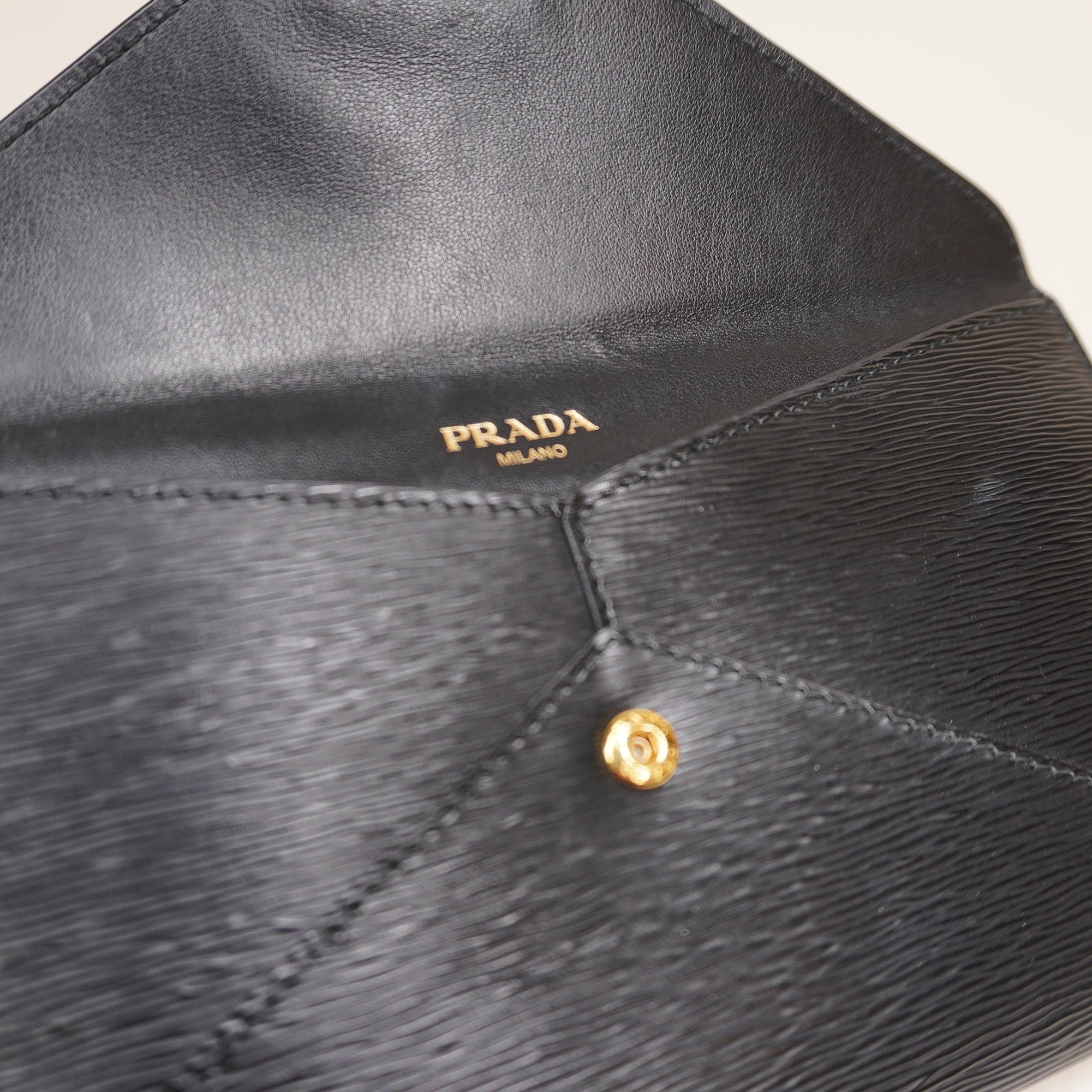 PRE-OWNED Black Vitello Move Envelope Clutch