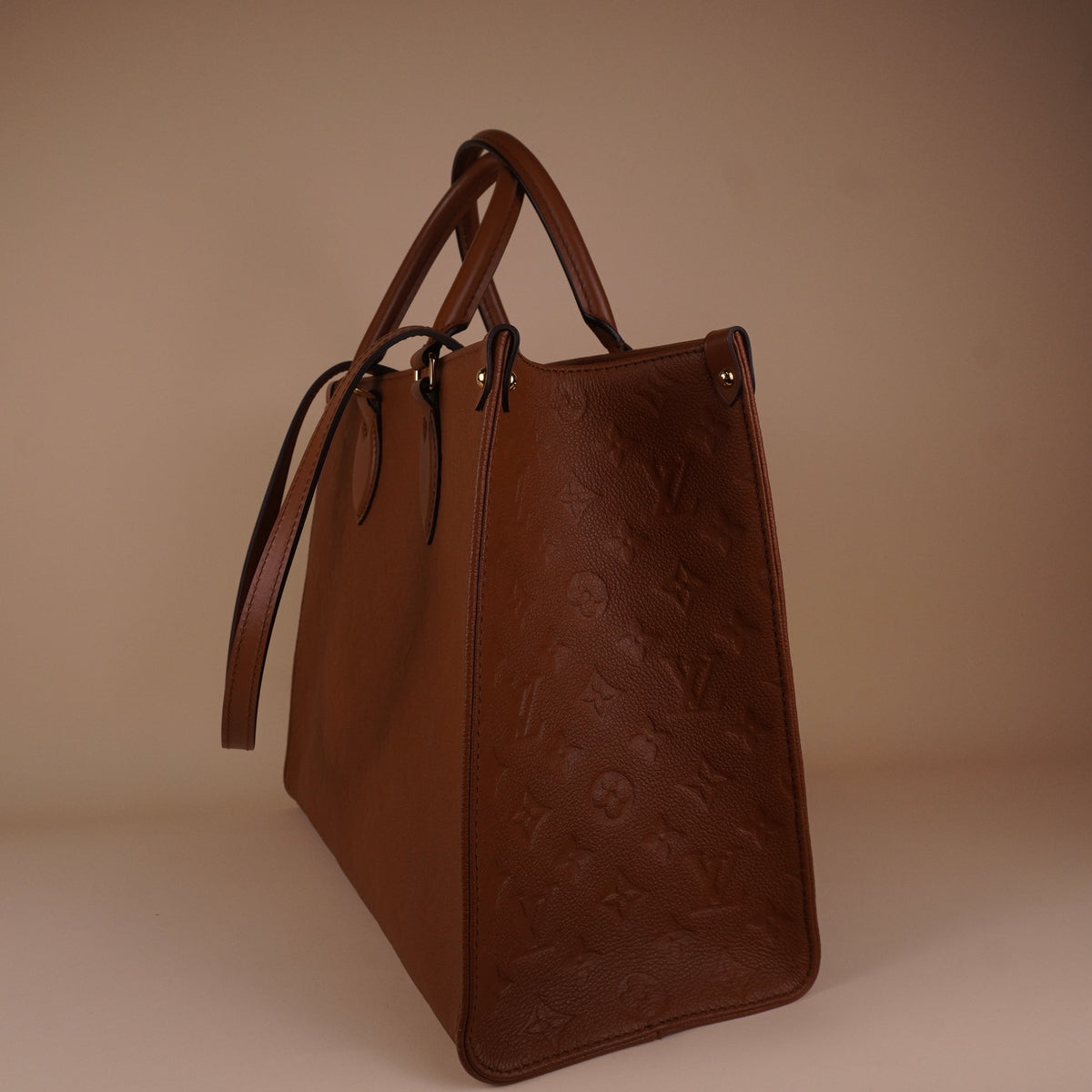PRE-OWNED LV Empreinte Monogram OnTheGo MM Shoulder Bag