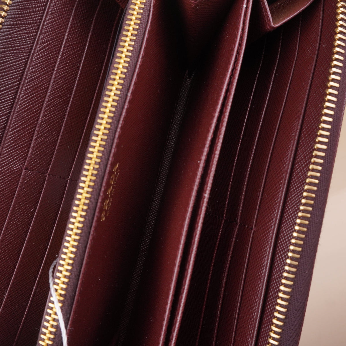 PRE-OWNED Saffiano Burgundy Zip-Around Wallet