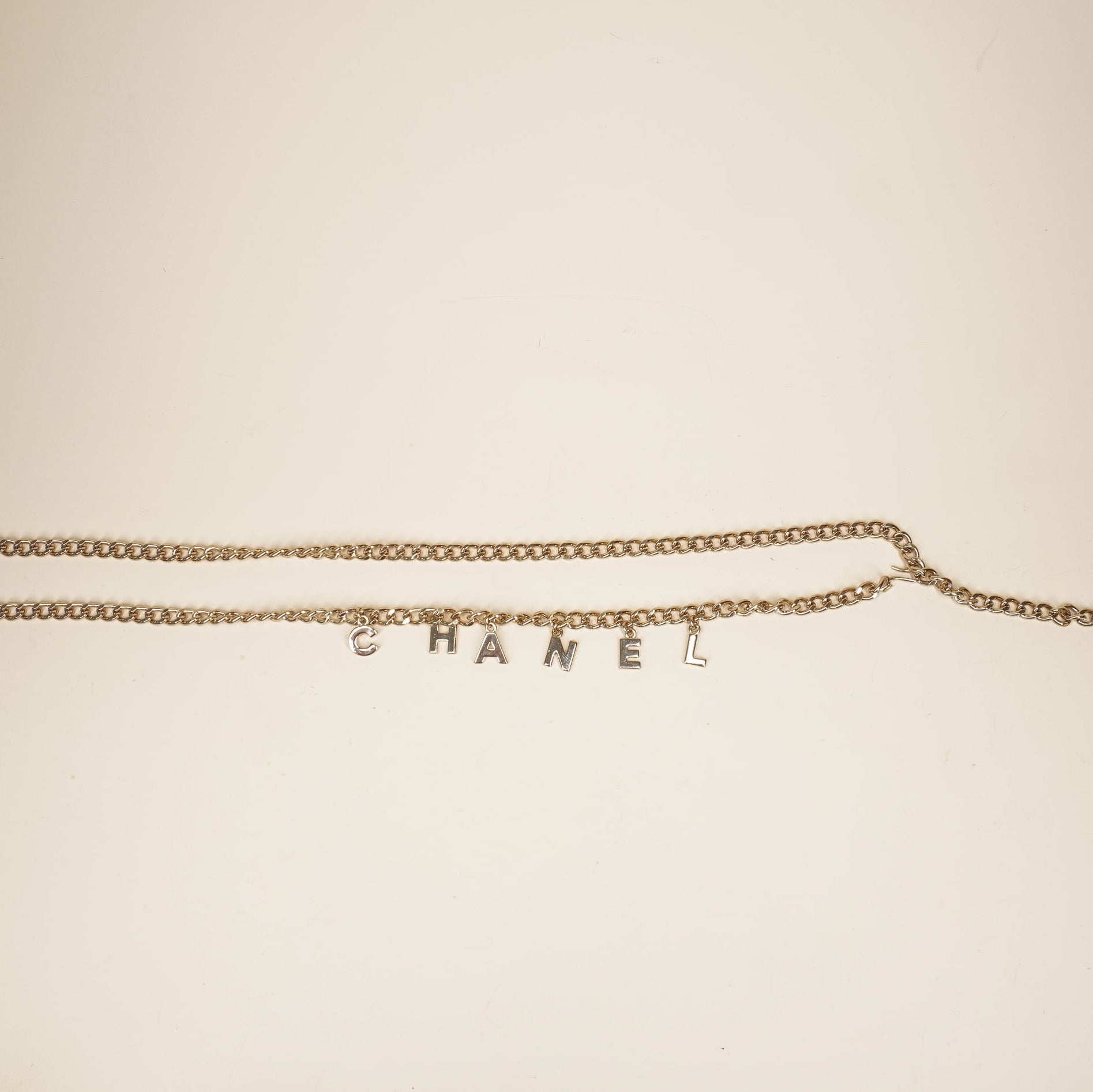 PRE-OWNED CC Letter Drop Chain Belt Light Gold Tone