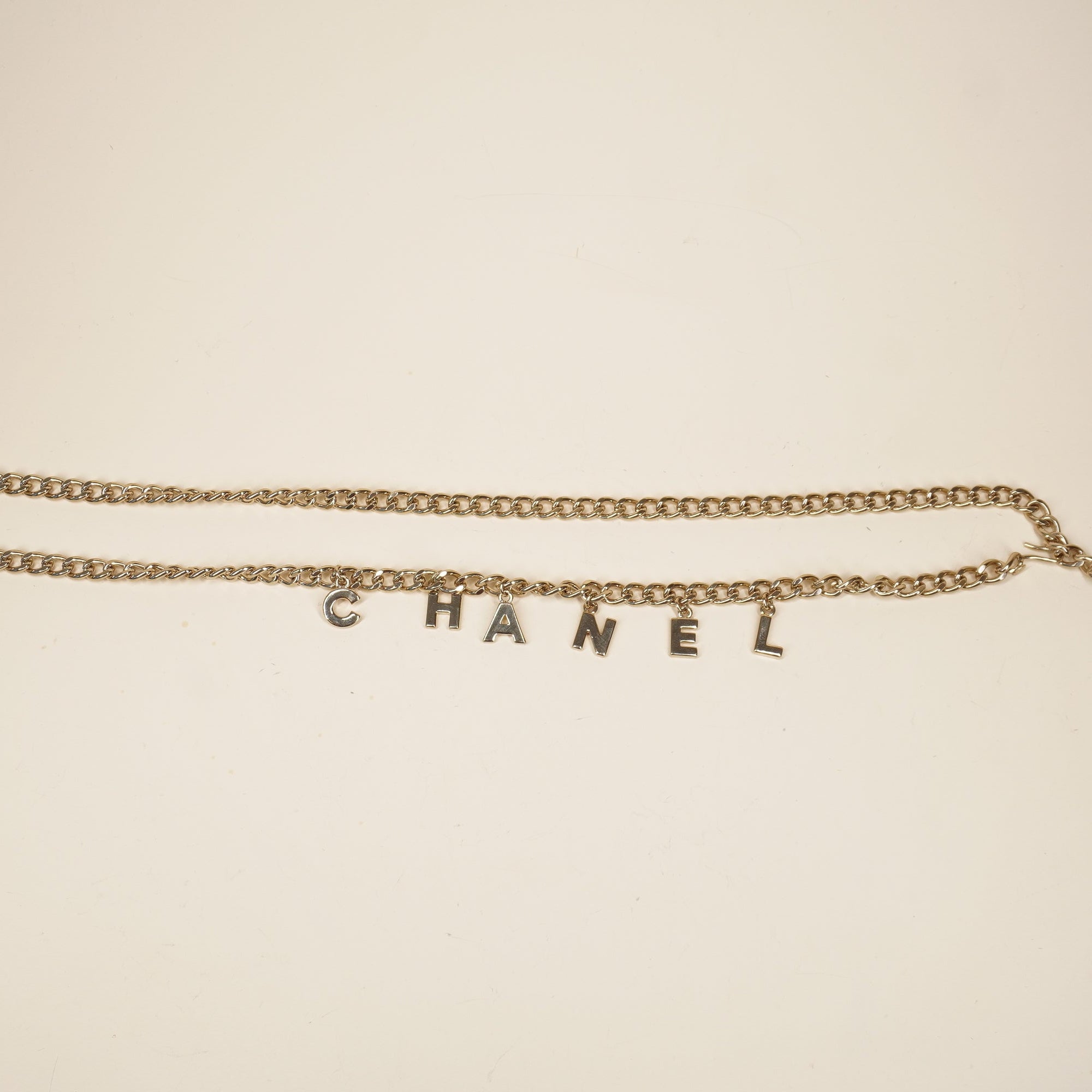 PRE-OWNED CC Letter Drop Chain Belt Light Gold Tone