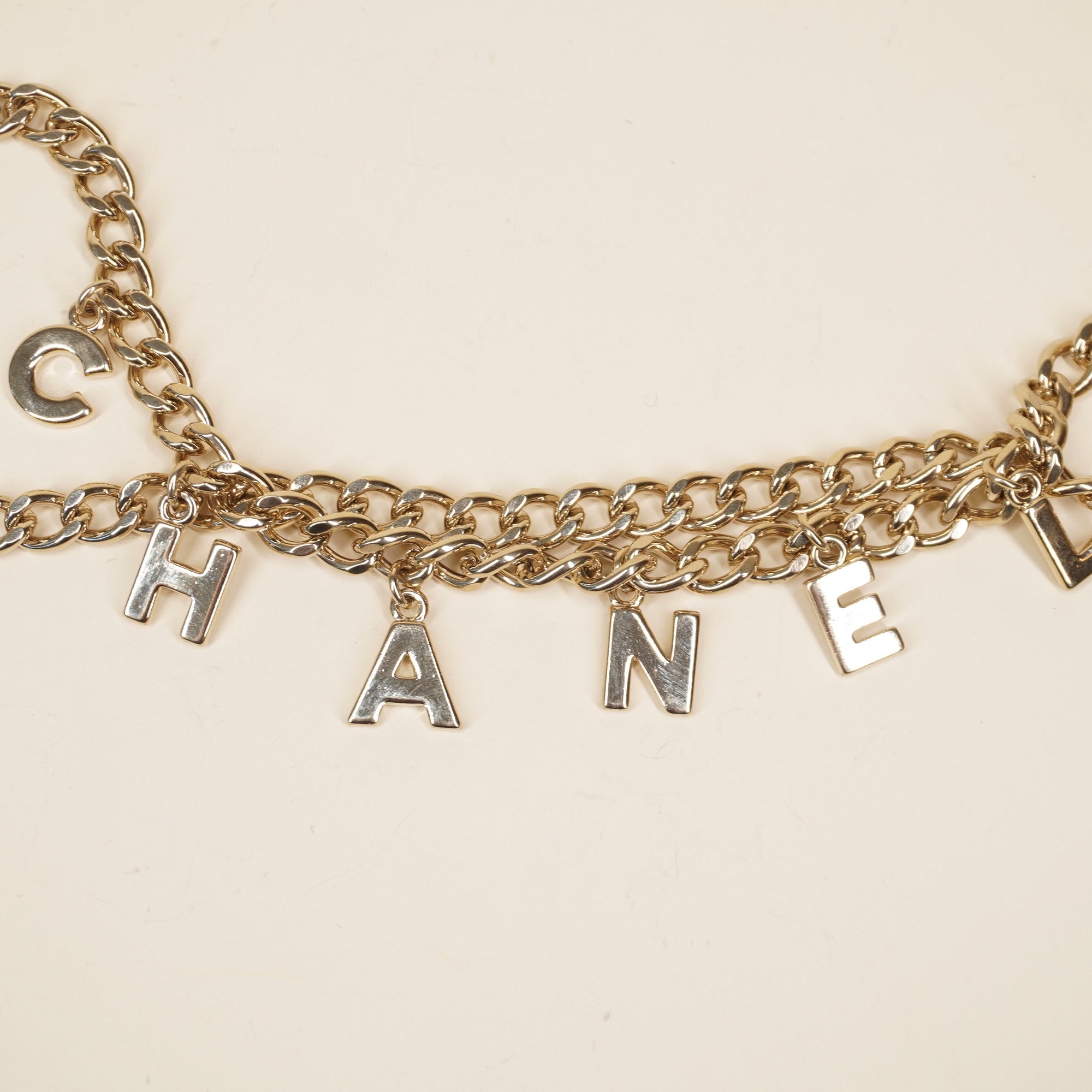 PRE-OWNED CC Letter Drop Chain Belt Light Gold Tone