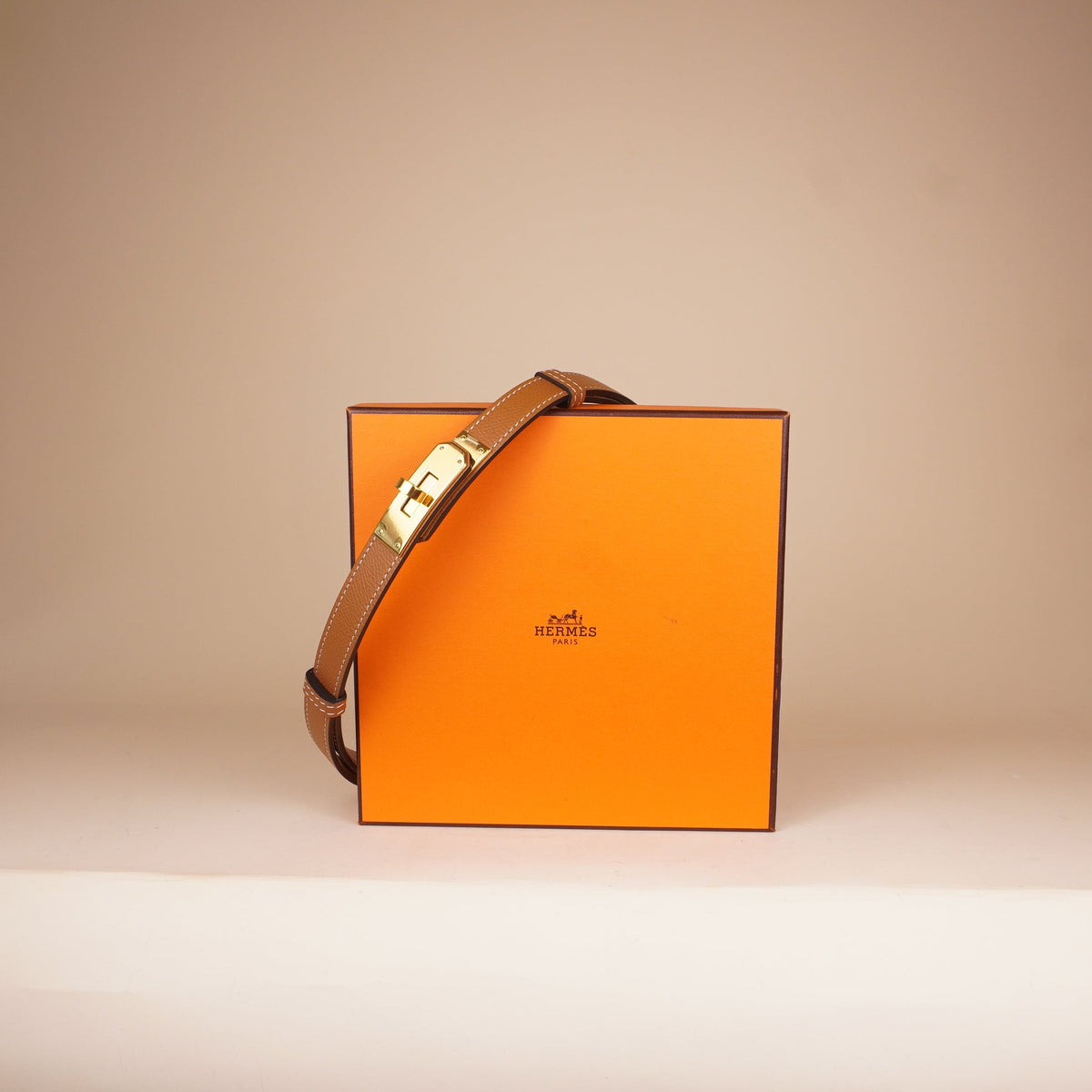 PRE-OWNED Brown Kelly 18 Belt in Gold Epsom
