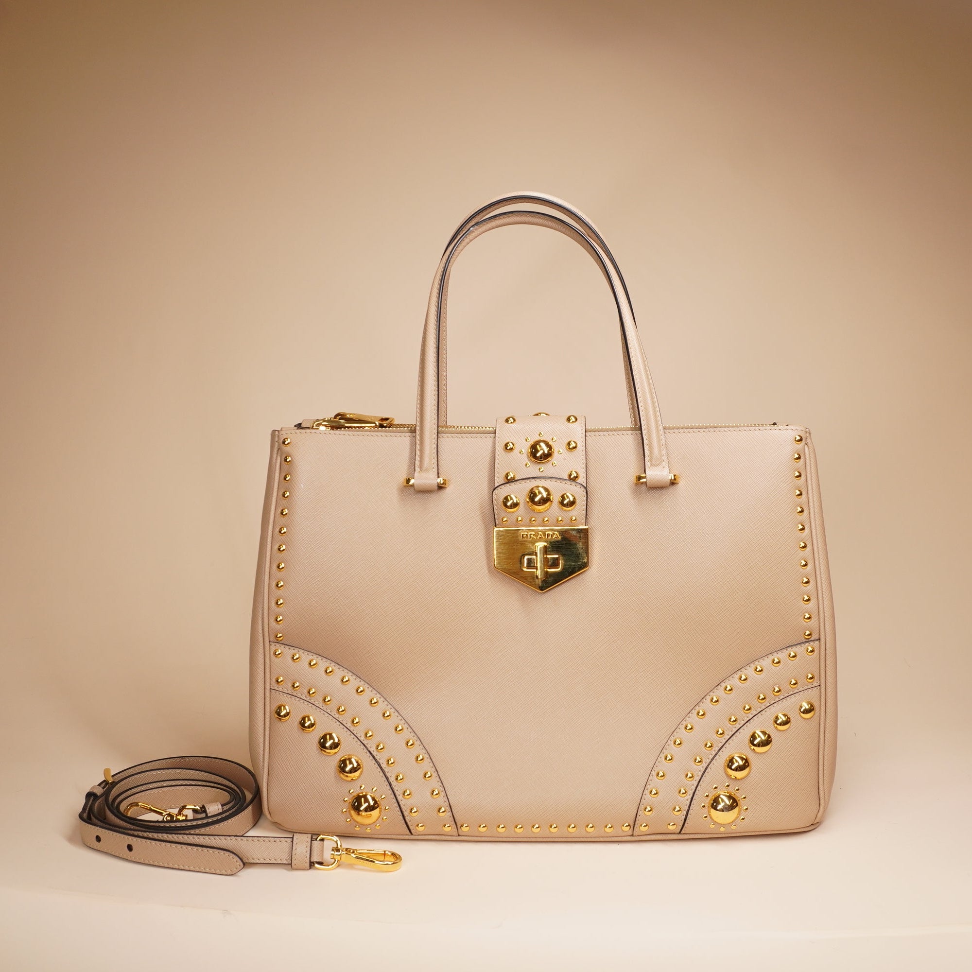PRE-OWNED Beige Turn Lock Studded Shoulder Bag