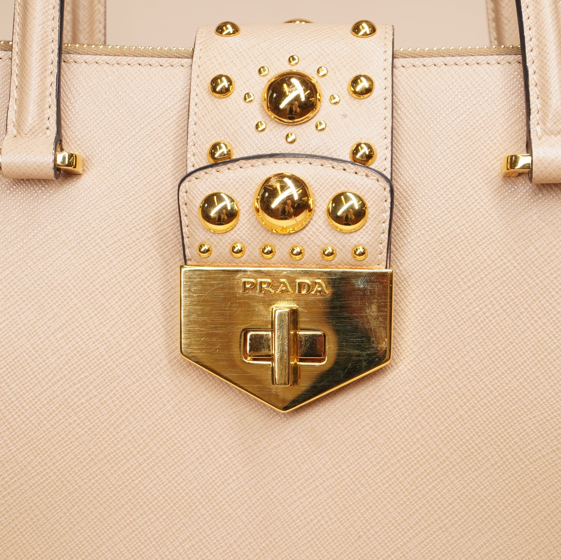 PRE-OWNED Beige Turn Lock Studded Shoulder Bag