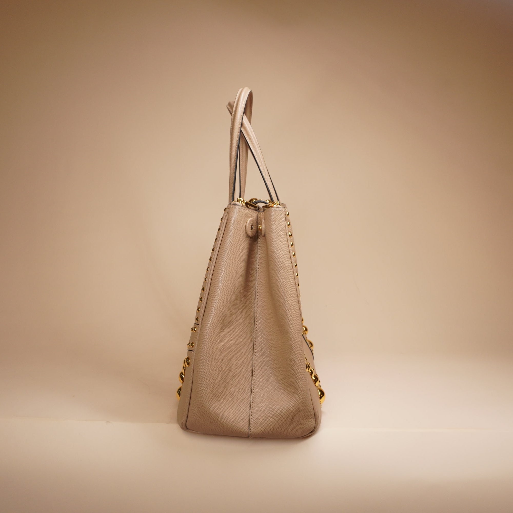 PRE-OWNED Beige Turn Lock Studded Shoulder Bag