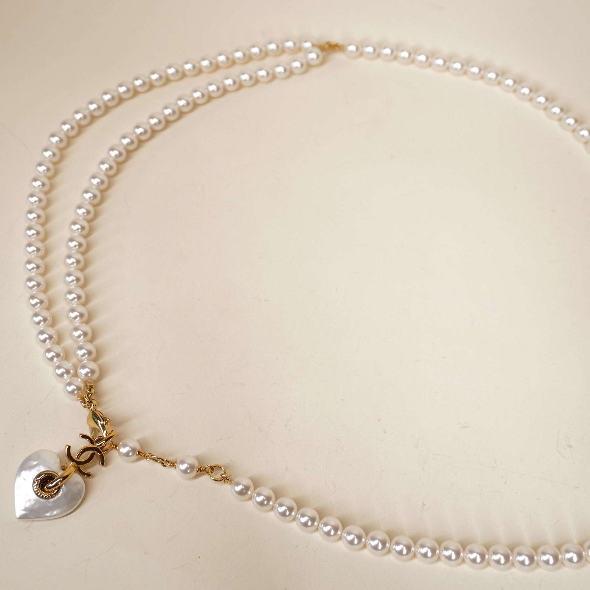 PRE-OWNED Faux Pearl Belt Double-Strand Heart and interlocking CC logo charm