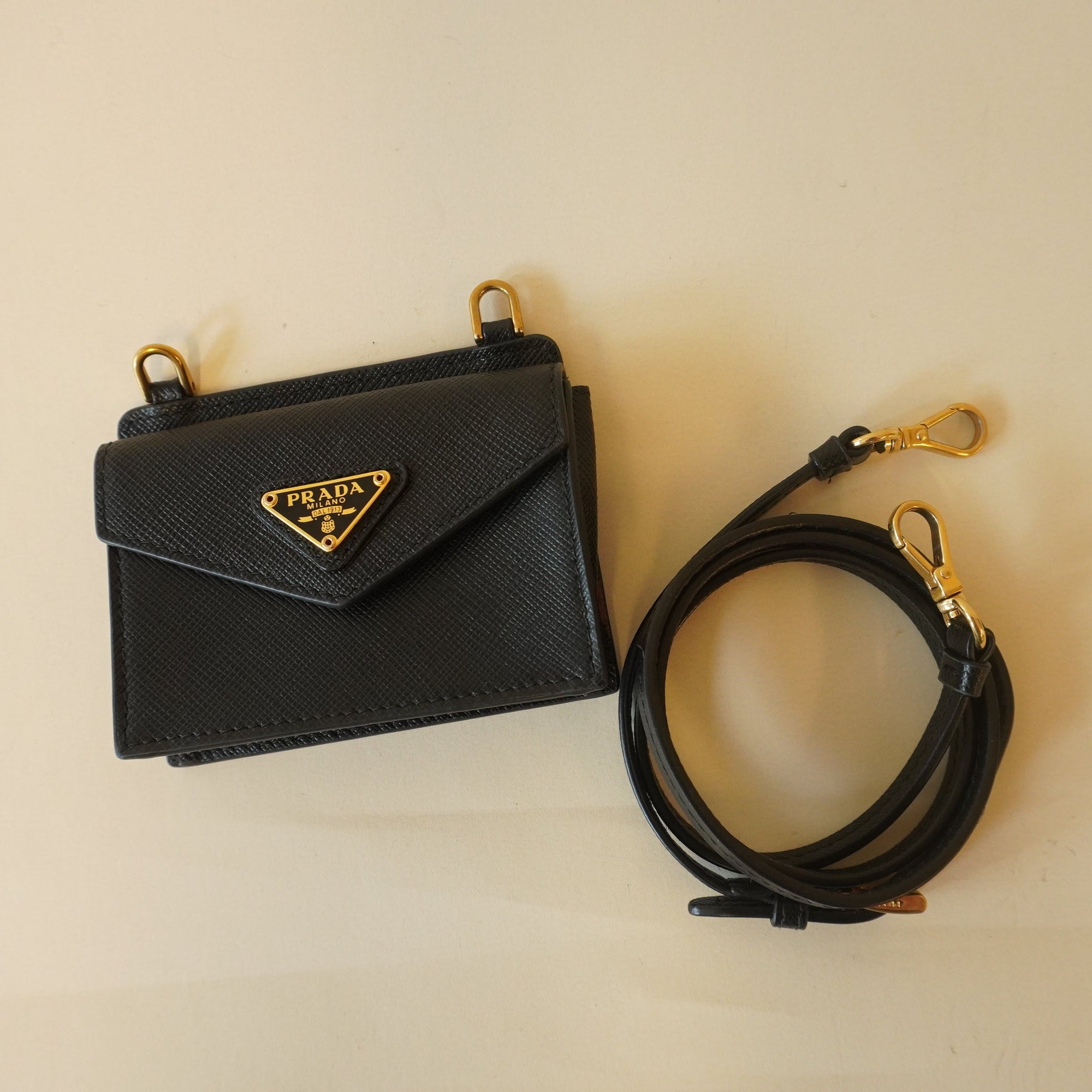 PRE-OWNED Saffiano Triangle Card Holder On Strap Black