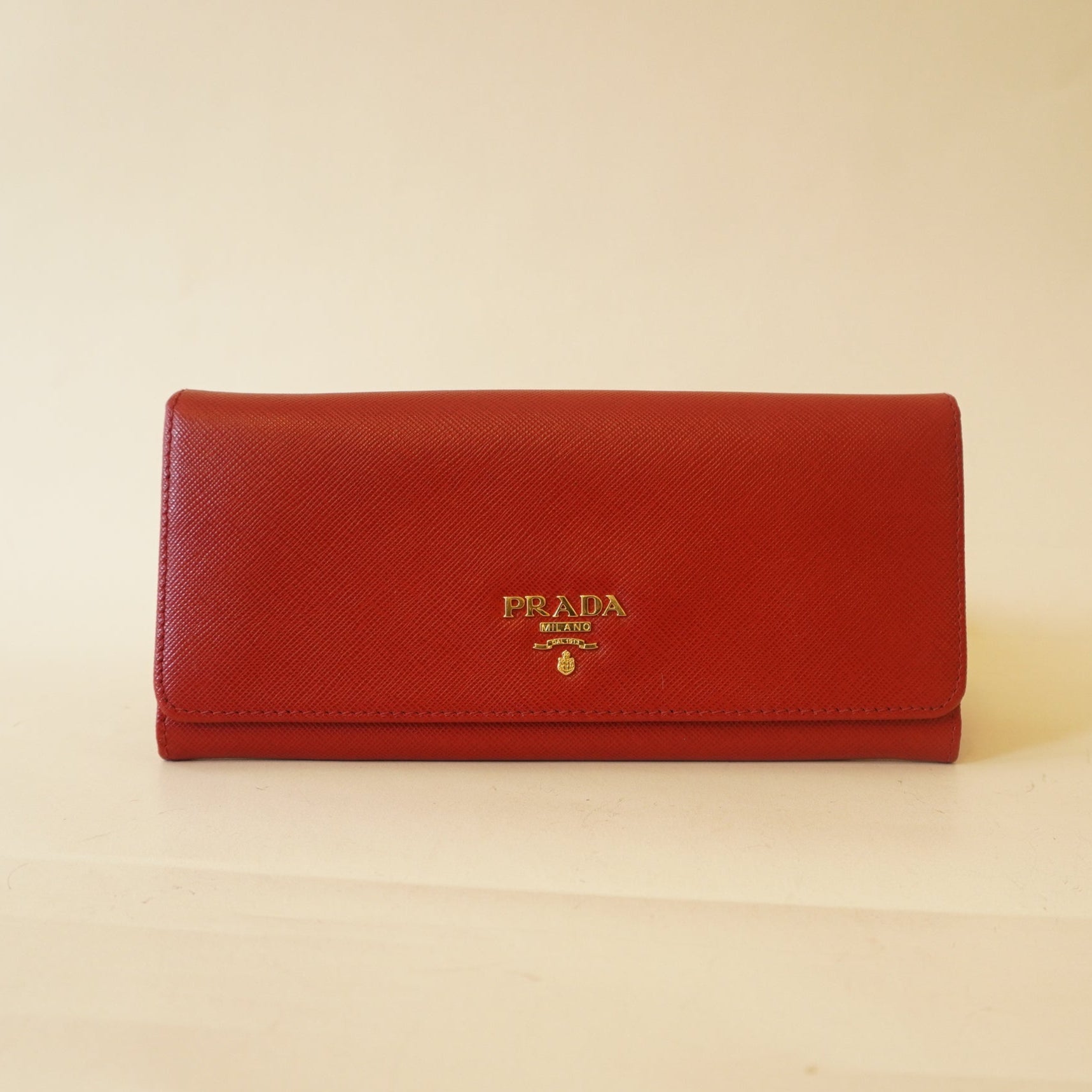 PRE-OWNED Red Saffiano Metal Continental Wallet
