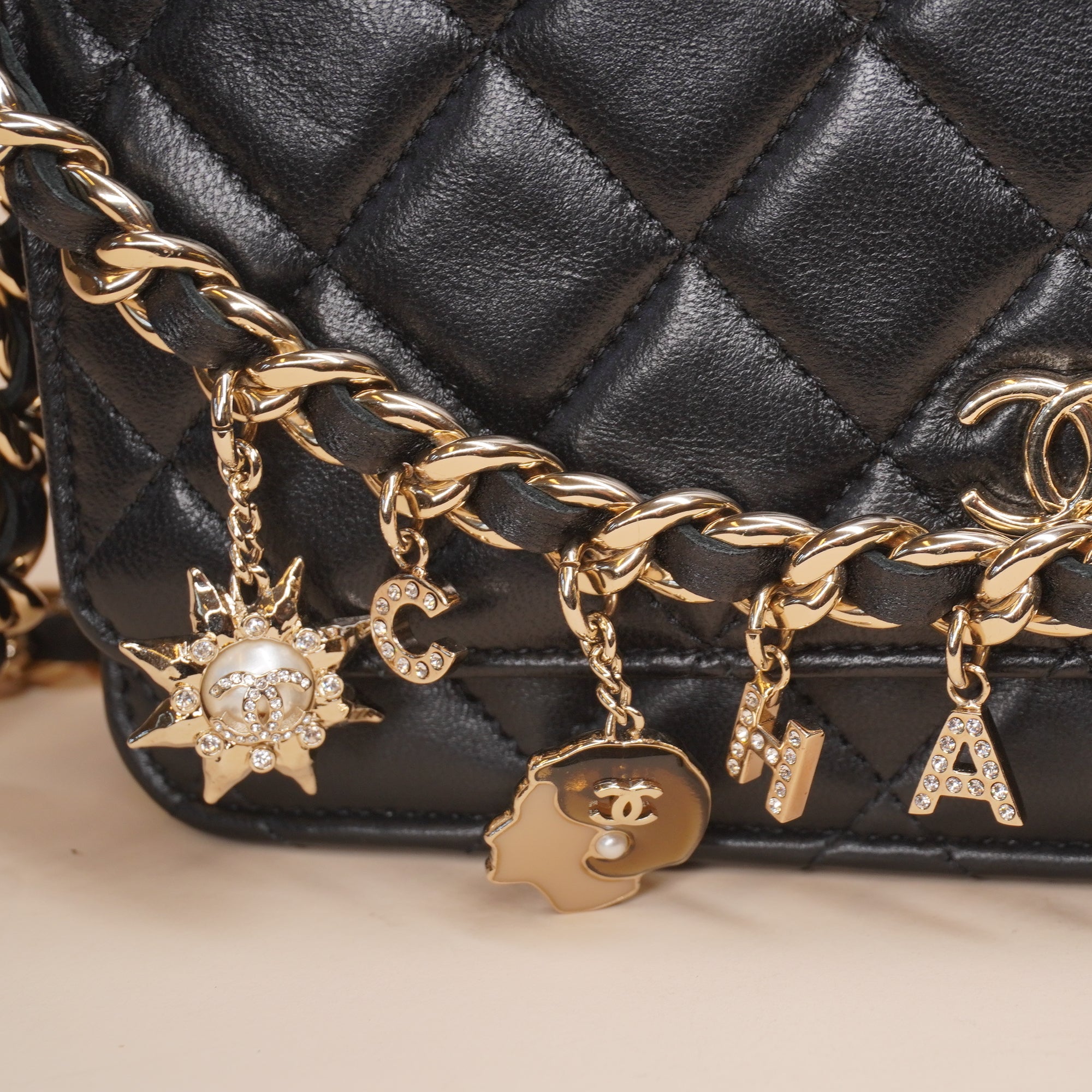 PRE-OWNED CC Black Lambskin Coco Charms Wallet on a Chain Crossbody Bag