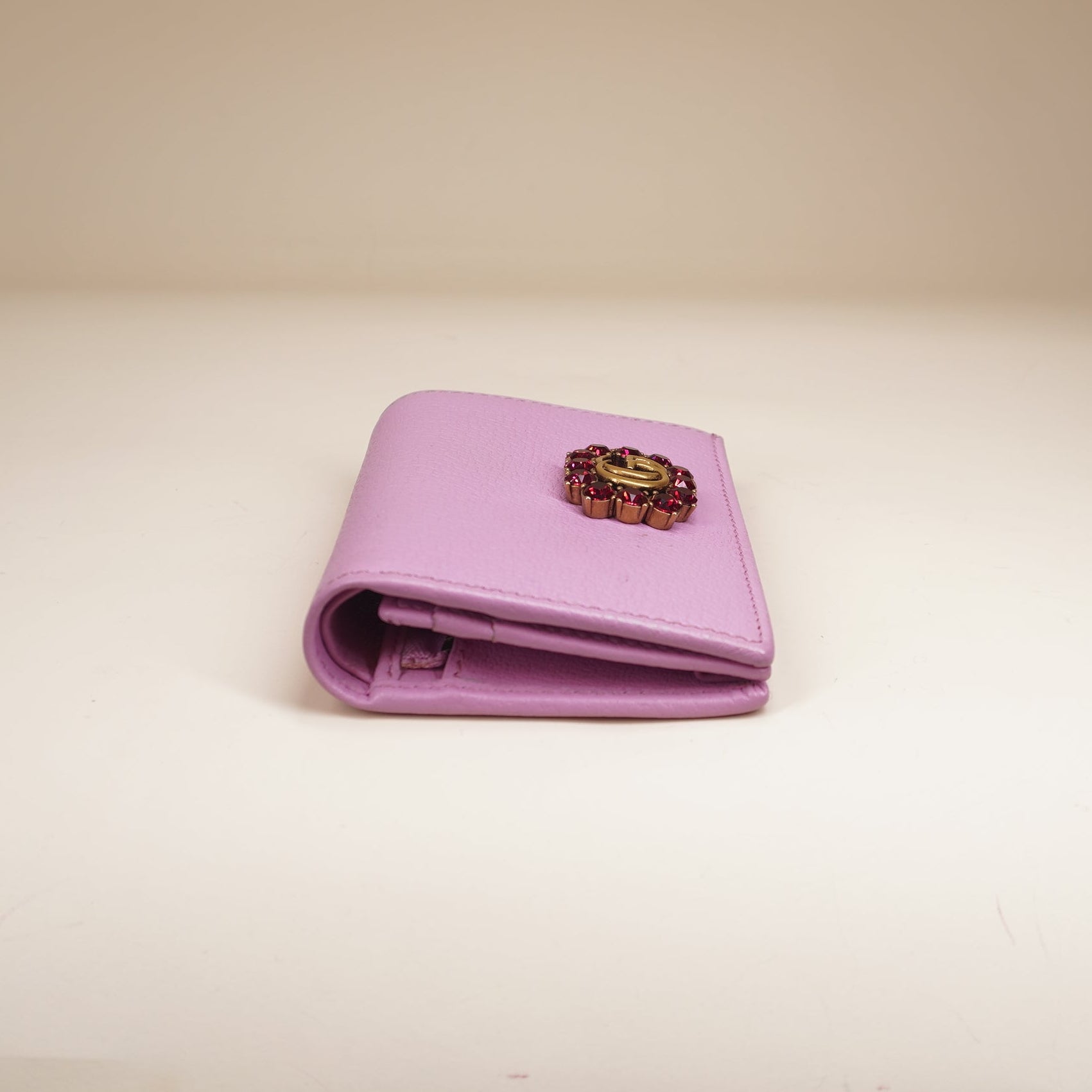 PRE-OWNED GG Marmont bi-fold wallet in pink leather with a crystal-encrusted Double G