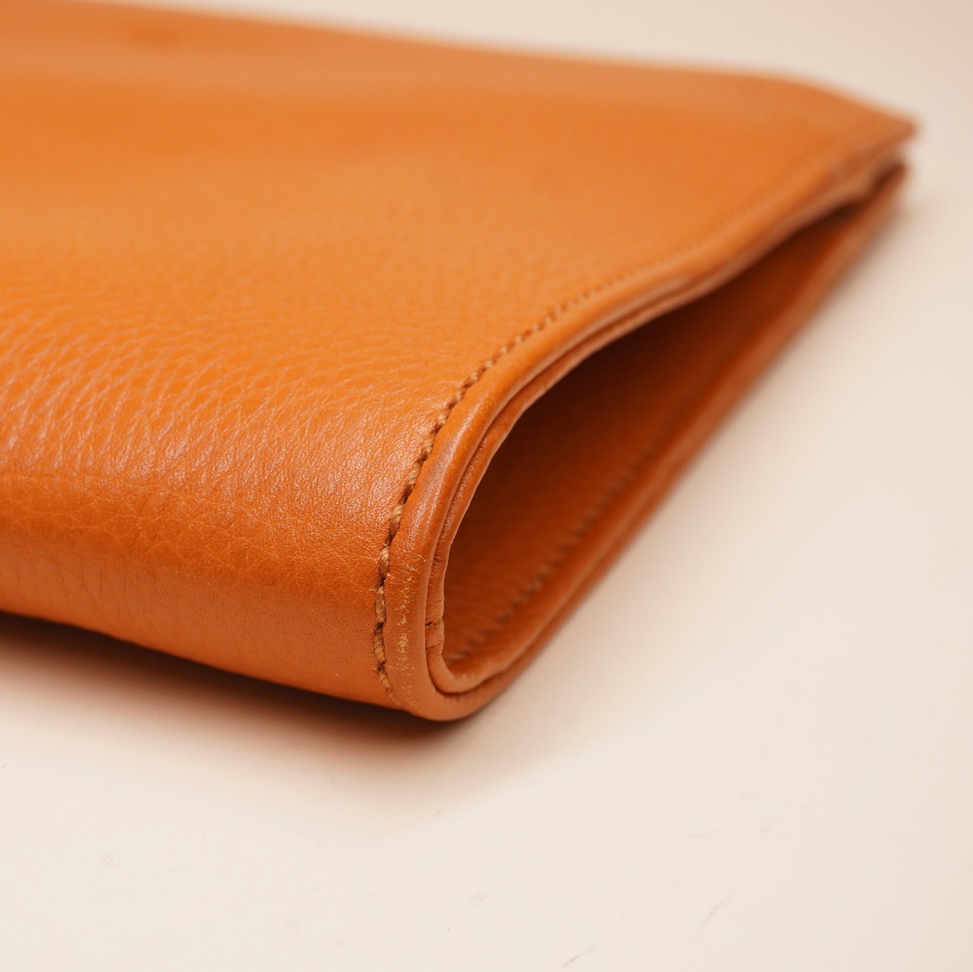 PRE-OWNED GG Orange Leather Bamboo Tassel Clutch