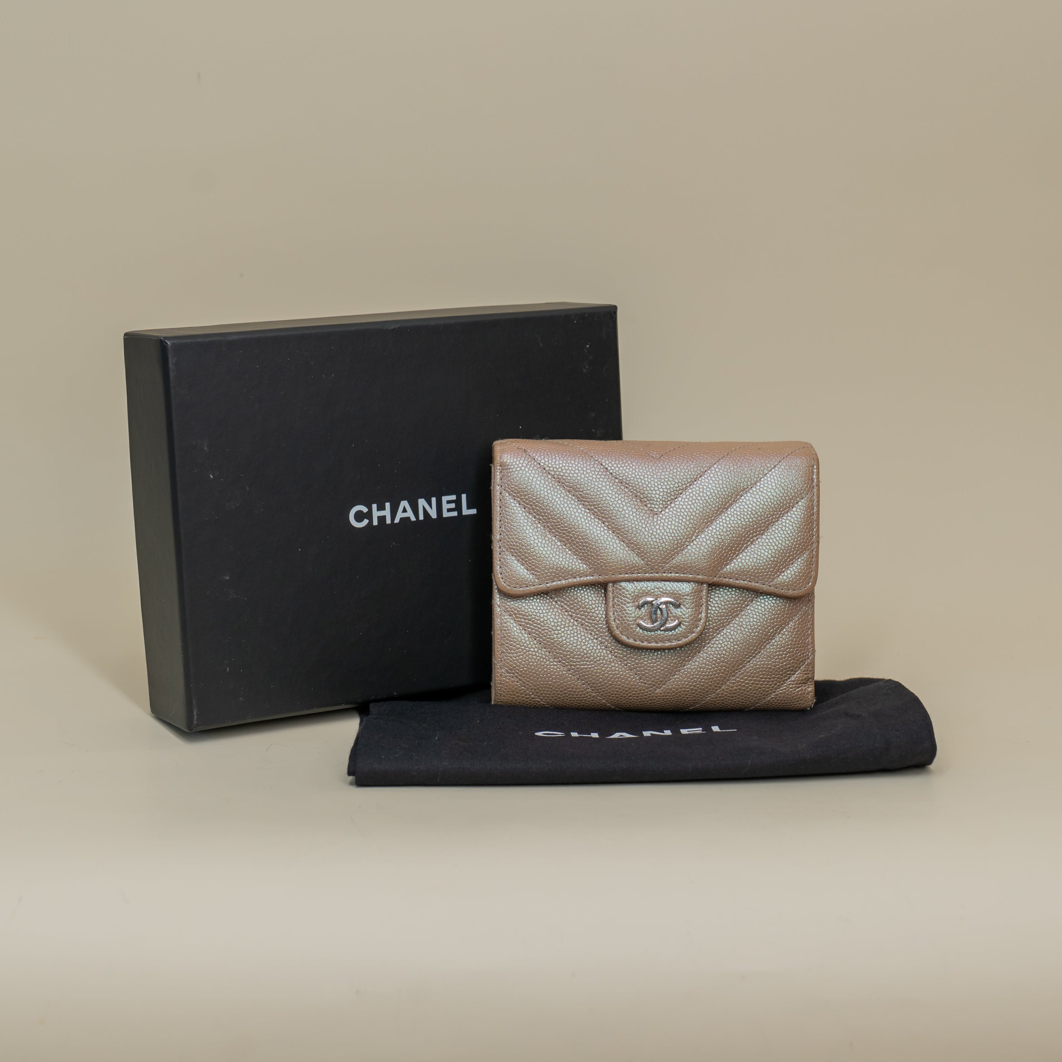 PRE-OWNED CC Light Gold Metallic Caviar Chevron Quilted Compact Flap Wallet