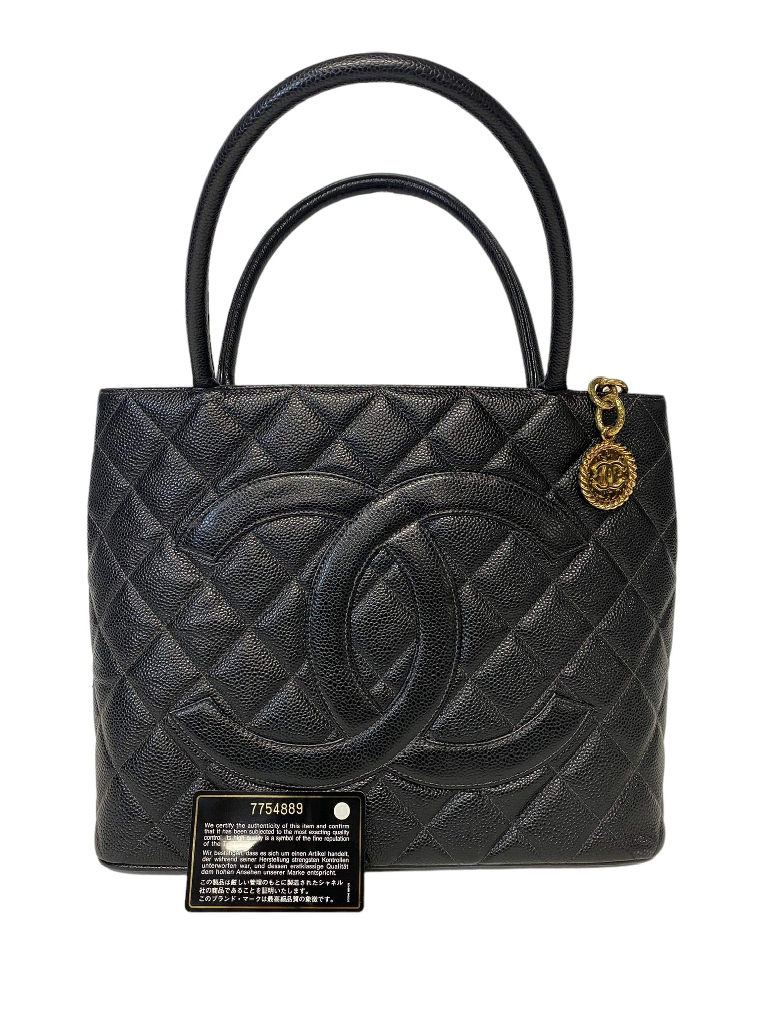 CHANEL - Bolso tote con medallón acolchado de caviar