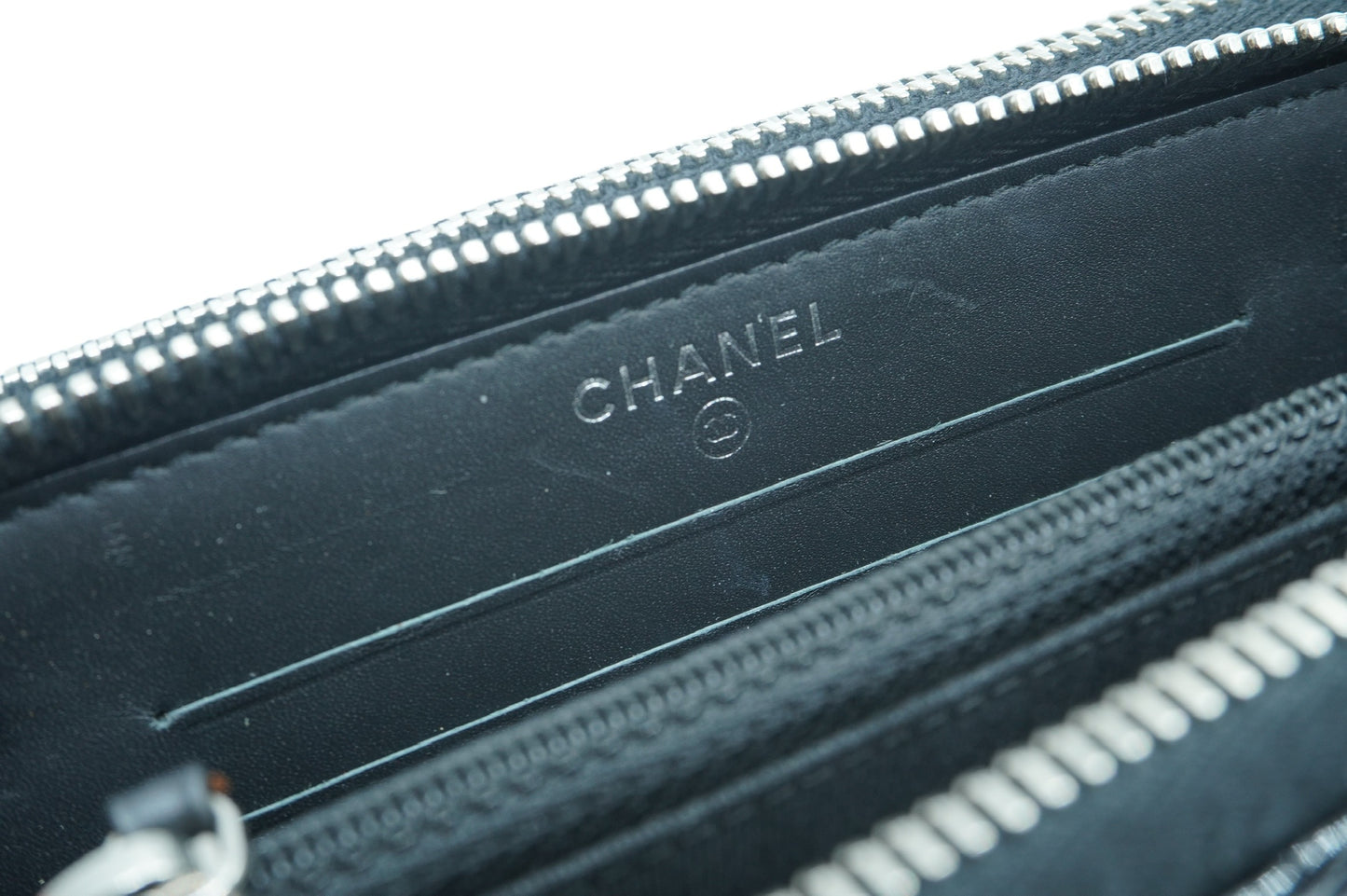 CHANEL - Black Matelasse Patent Round Zip Wallet
