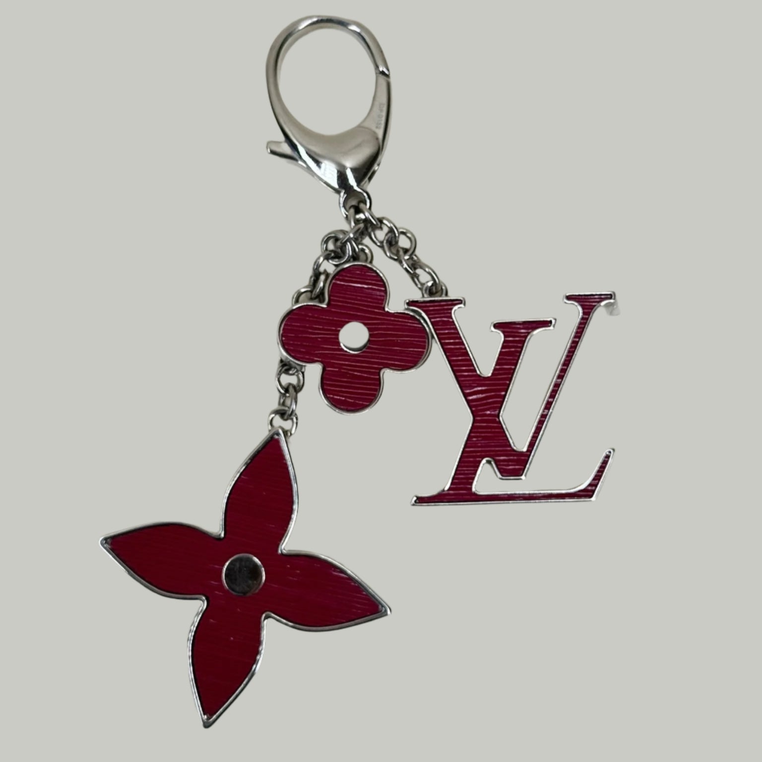 Charm para bolso Fleur d'Epi fucsia LV USADO